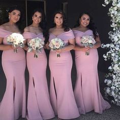 the bridesmaids are all dressed in pink gowns and holding their bouquets