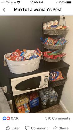 the microwave is full of food and has two baskets on it, along with other items