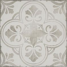 a white and gray tile with an ornate design