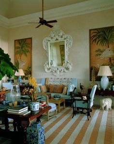 a living room filled with lots of furniture and decor