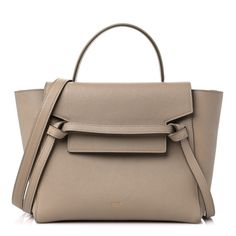 This is an authentic CELINE Grained Calfskin Mini Belt Bag in Light Taupe. This chic tote is crafted of richly textured calfskin leather with a structured and spacious silhouette in beige. The bag features a leather strap top handle, an optional shoulder strap, and a facing flap secured by a strap and brass magnet. This opens to a beige suede leather interior. Classic Taupe Calf Leather Bag, Beige Calf Leather Satchel With Top Handle, Beige Calf Leather Business Bags, Beige Calf Leather Satchel For Office, Beige Calf Leather Bags For Business, Taupe Calf Leather Bag For Formal Occasions, Taupe Textured Leather Business Bag, Office Beige Calf Leather Satchel, Elegant Soft Leather Bag In Neutral Color