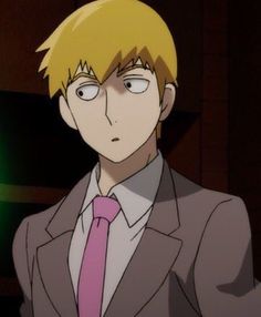 a man with blonde hair wearing a suit and tie