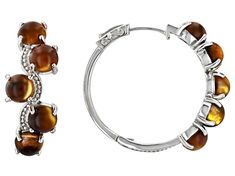 6mm Round Cabochon Tigers Eye Rhodium Over Sterling Silver Hoop Earrings. Measures Approximately 1.17"L x 0.47"W. Hinge with Noted post. Brown Tiger Eye, Sterling Silver Hoop Earrings, Tigers Eye, Sterling Silver Hoops, Silver Hoops, Silver Hoop Earrings, Tiger Eye, Tigers, Hoop Earrings