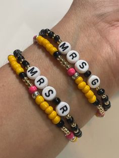 two bracelets that say mr and mrs on the front, one with candy beads