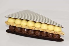 a piece of food with chocolate and bananas on it