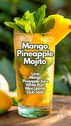 the mango pineapple mojito is served in a tall glass with minty garnish