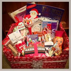 a red suitcase filled with lots of holiday items