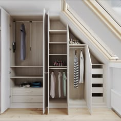 an open closet with clothes and other items in it