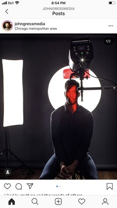 a man sitting in front of a camera