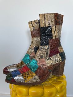 "ITEMS PURCHASED BETWEEN 11/20-1130 WILL SHIP 12/1  Andy from JJ Flash would fly to England and have these boots custom made.  As is, no returns. See full description and images. Description:  Iconic early 1970s patchwork snakeskin boots. Patchwork outer with metallic red, blue, silver, and teal, pink, green, black, brown, yellow, and natural toned snakeskin. Lined in solid brown leather. Interior zipper and wooden stacked heel. \"Made in England\" stamped on the bottom. Damage notes: Wear consi 1970s Glam Rock, 1970s Glam, Snakeskin Boots, Weird Fashion, Glam Rock, Stacked Heel, Ultra Violet, Snake Skin, Style Icons