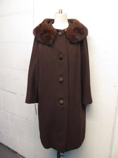 Up for sale is this stunning vintage 1950's cropped Mink fur collar wool swing coat. With distinct cord wrapped buttons. Silk lining has some minor wear. Sz M/L measurements below. Message with any additional questions. Don't forget to check out our other vintage items. Thanks for looking. measurements Bust  length Vintage Brown Outerwear With Faux Fur Trim, Brown Wool Coat, 1950s Outfits, Coat Vintage, Brown Coat, Swaggy Outfits, Gingham Dress, Mink Fur, Oct 31