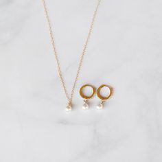 This exquisite handcrafted pearl necklace and huggie hoops gift set are a timeless fusion of elegance and style.  The necklace features a lustrous pearl delicately hanging on a chain, creating a classic yet modern look. Paired with my sleek Huggie diamond cz hoops adorned with subtle detailing, this set is the perfect balance of sophistication and versatility.  Elevate any outfit with this thoughtful and beautifully crafted ensemble, making it an ideal gift for those who appreciate the finer things in life. THE DETAILS:💜  14K Gold-filled Necklace & 14k Gold-Filled Hoops  14, 15, 16, 18, or 20 inches.  (14= small choker, 15= large choker, 16= collarbone, 18= standard, 20= long) Heavily Gold Plated Brass CZ Bee charm size 8mm (25mm=1 inch) Cubic Zirconia Stones  Option to be adjustable with Yellow Gold Jewelry With Pearl Pendant Dangle, Fine Jewelry Dangle Pearl Charm, Everyday Pearl Drop Pendant Jewelry, Yellow Gold Pearl Jewelry Gift, Dangle Jewelry With Pearl Charm For Anniversary, Everyday Dangle Pearl Pendant Jewelry, Fine Jewelry Pearl Pieces For Everyday, Delicate Round Pearl Charm Jewelry, White Gold Dangle Earrings With Pearl Charm