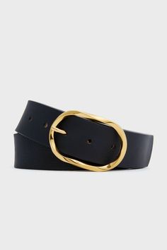 Founded on the belief that belts can instantly elevate an outfit, B-Low the Belt creates pieces that are functional, fashion-forward, and always coveted.The Black Kyra Belt is an essential addition to your year-round closet. With cowhide black leather and a gold-toned polished buckle, this can serve as a classy detail for any outfit. Wear with a button-down and french tuck for an sophisticated statement, with a dress or blazer to cinch the waist, or with a body suit and skirt for a touch of elegance. 
Adjustable length
5 holes
Gold-tone oval buckle closure
Material: Italian Cowhide Leather (belt), Nubuck Leather (lining), Italian Hardware (buckle)
Made in USA Suit And Skirt, Round Closet, French Tuck, Thick Belt, B Low The Belt, Functional Fashion, Cocktail Attire, Nubuck Leather, Body Suit