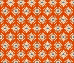 an orange background with white and blue flowers on it, which are arranged in the shape of circles