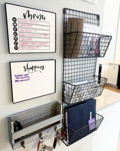 three metal baskets hanging on the wall next to each other with magnets attached to them