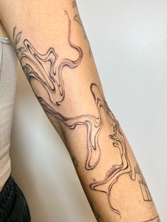 a person with a tattoo on their arm