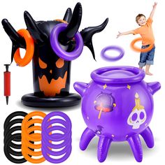 an inflatable halloween decoration with a boy jumping over it and other items surrounding