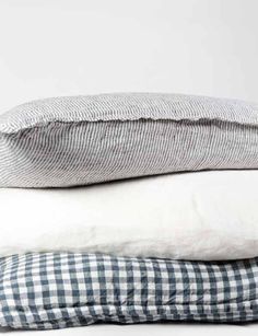 three pillows stacked on top of each other