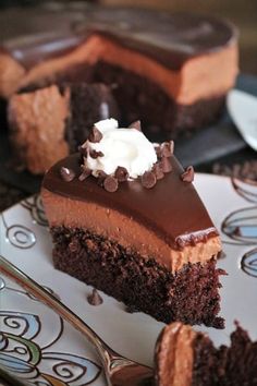 a piece of chocolate cake with whipped cream on top