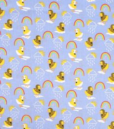 a blue fabric with ducks and rainbows on it's side, in front of a sky background