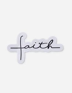 a sticker that says faith with the word faith written in black ink on it