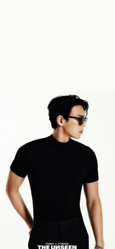 a young man wearing sunglasses and a black t - shirt with the words,'the unseen