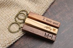 two wooden keychains with i love you and mr and mrs engraved on them