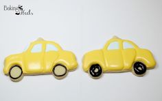 two yellow car shaped cookies sitting next to each other