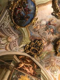 an ornate ceiling with paintings on it