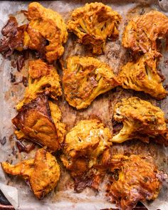 some food is laying out on a piece of parchment paper and ready to be eaten