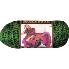 a ball of yarn with a woman sitting on the bed in front of it and text that reads, homespun