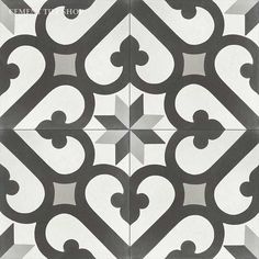 a black and white tile design on the floor