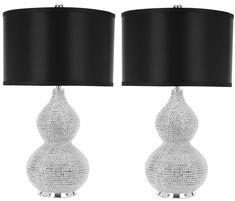 two lamps with black shades on them