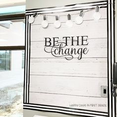 there is a sign on the wall that says be the change