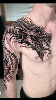 a man with a dragon tattoo on his chest