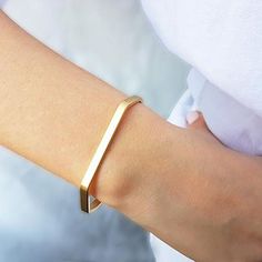 The Gold Minimalist Cuff Bracelet brings a classic style to your everyday piece. With a polished finish, this skinny bracelet is 14K gold filled. You can wear this piece on its own or stack it with other HLcollection bracelets. PRODUCT DETAILS: 4 mm wide bracelet. Open cuff - will fit most wrists MATERIALS: 14K Gold Filled 14K Gold Filled jewelry is not the same as gold-plated jewelry. It contains 5% of solid gold and is done by a process of heat bonding. The layer of gold is permanently bonded Adjustable Matte Gold Minimalist Bracelet, Modern 14k Gold Cuff Bracelet For Everyday, Minimalist 14k Gold Cuff Bracelet Gift, Minimalist Gold Bangle Cuff Bracelet, Minimalist Yellow Gold Cuff Bracelet For Everyday, Minimalist Yellow Gold Everyday Cuff Bracelet, Adjustable Minimalist 14k Gold Bangle, Minimalist Yellow Gold Cuff Bracelet, Sleek Everyday Bangle Bracelets