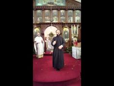 the priest is standing in front of the altar