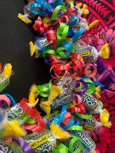 a pile of candy wrapped in colorful ribbons