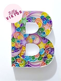 the letter b is made up of multicolored paper