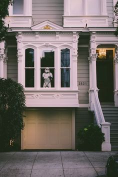 a house with a teddy bear in the window