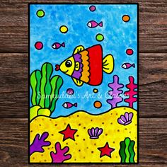 a painting of a fish on a wooden surface