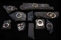 an assortment of rings and bracelets on display