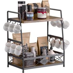 a shelf with coffee cups, mugs and other kitchen items on top of it