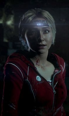 a woman in a red hoodie with blood on her face