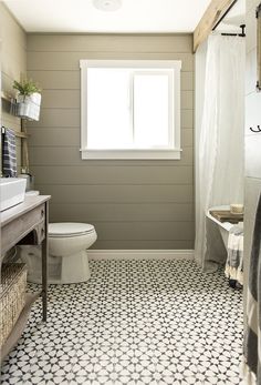 the bathroom is clean and ready to be used as a family room or office space