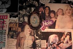 a wall covered in posters and pictures next to a magnifying glass with the word hole written on it