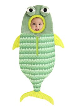 a baby in a green and yellow fish costume with eyes on it's head