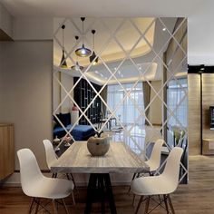 a dining room table with white chairs around it