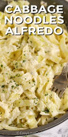 cabbage noodles alfredo in a skillet with a fork and text overlay that reads cabbage noodle alfredo