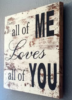 a wooden sign that says, all of me loves all of you